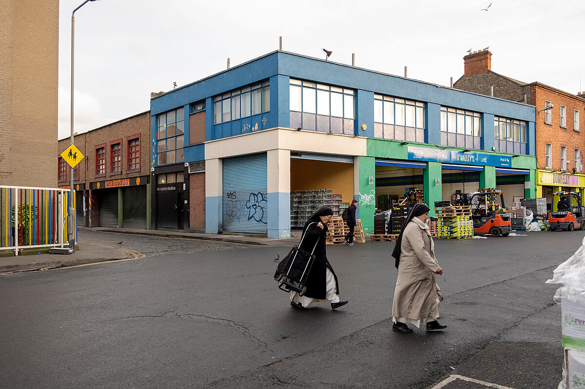 Nuns shopping at the market | Colour photograph