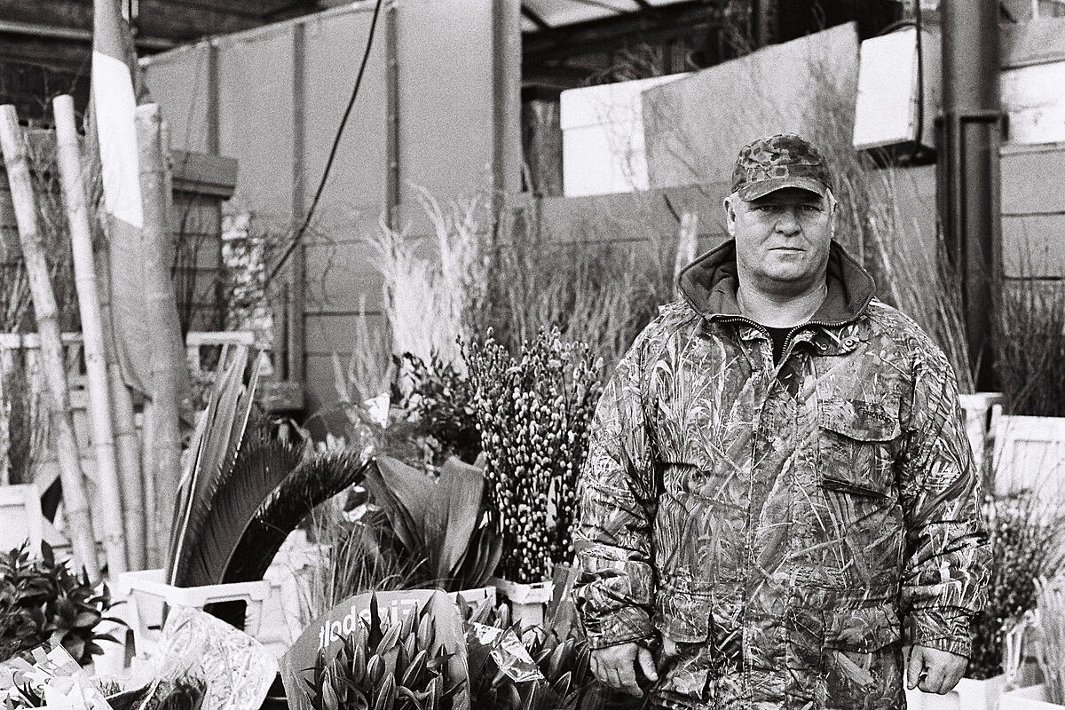 Flower delivery man in camouflage | B&W photograph