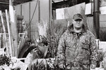 Flower delivery man in camouflage | B&W photograph