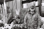 Flower delivery man in camouflage | B&W photograph