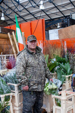 Flower delivery man | Colour photograph