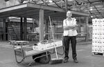 Market cleaner with his trolly and brush | B&W photograph - 2016