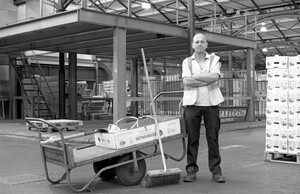 Worker with his trolly and brush