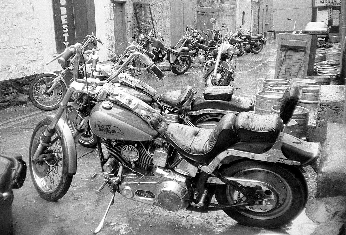 Harleys in Buddies lane | B&W photograph - 1990