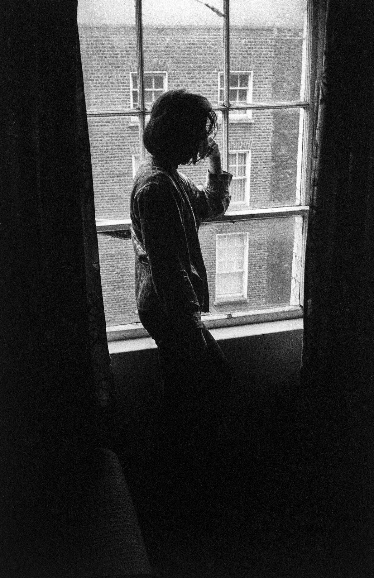 The visitor by the window | B&W photograph - 1990