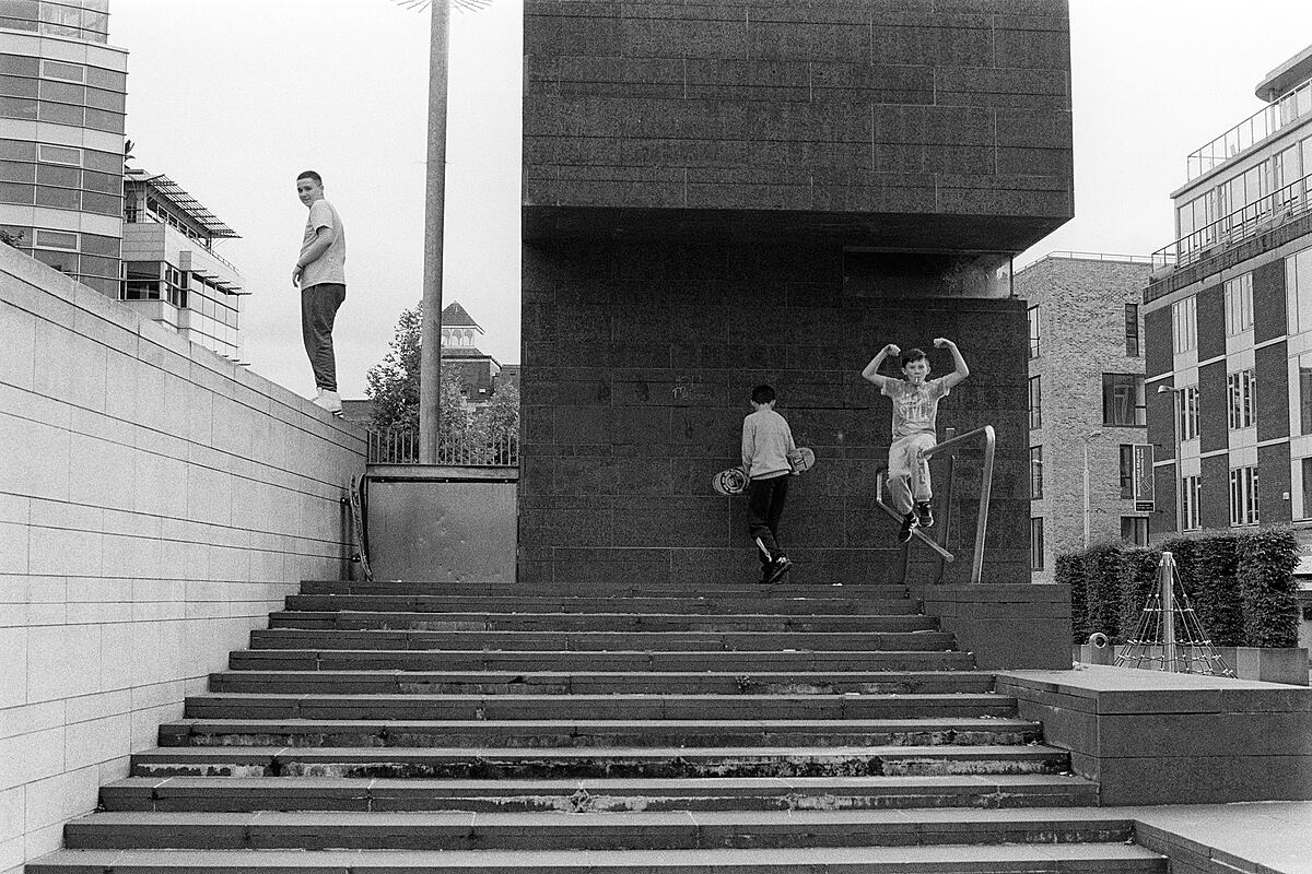 The boys on the steps, Smithfield Square | B&W photograph